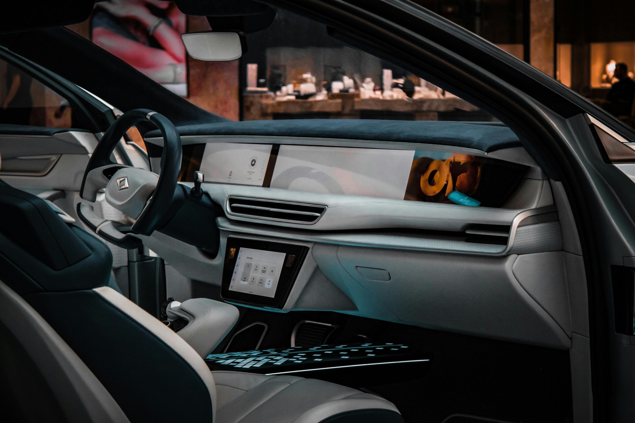 Explore the sleek and modern design of a luxury car interior, showcasing advanced technology and premium materials.