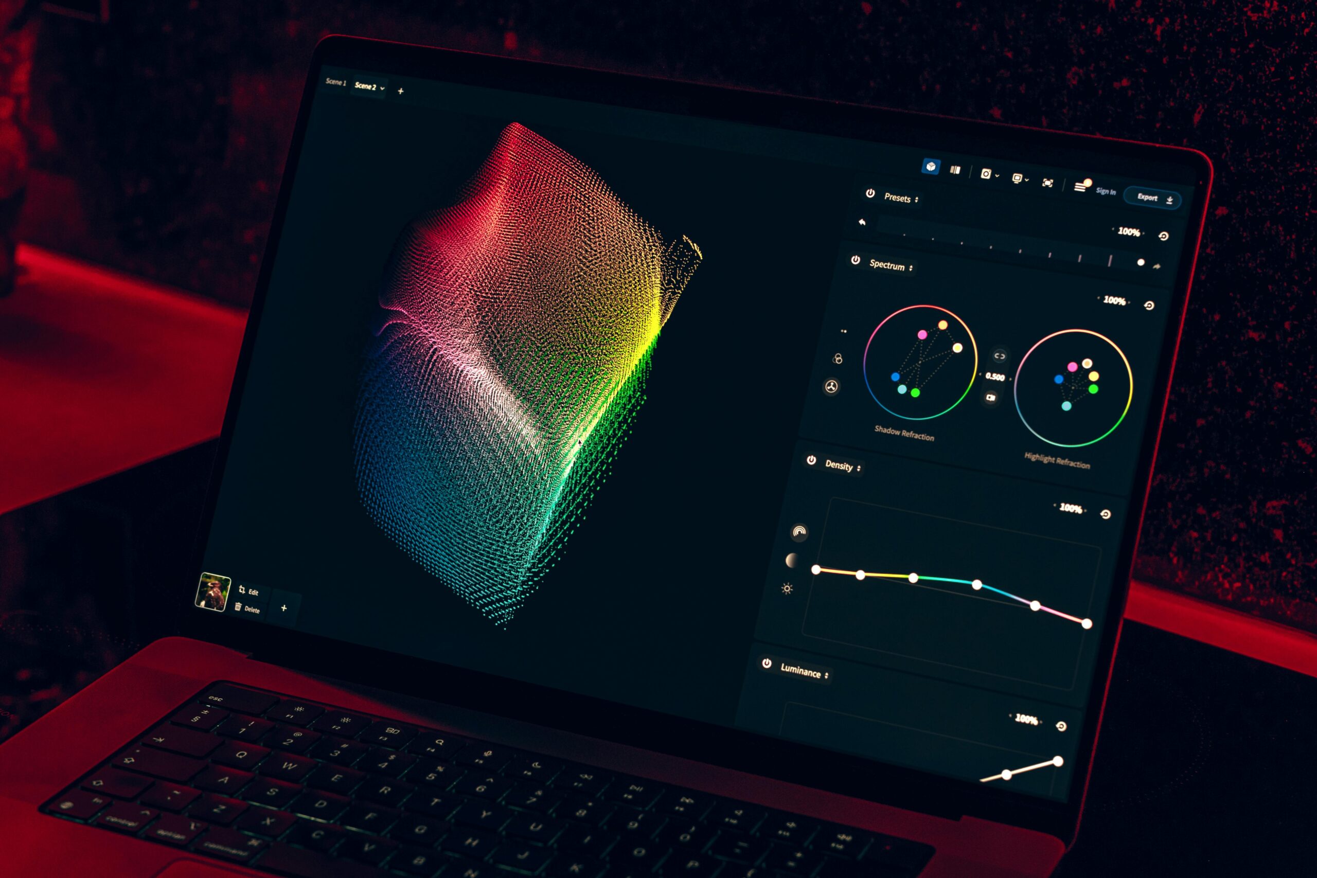 Close-up of a colorful data visualization displayed on a laptop screen in a dimly lit room.