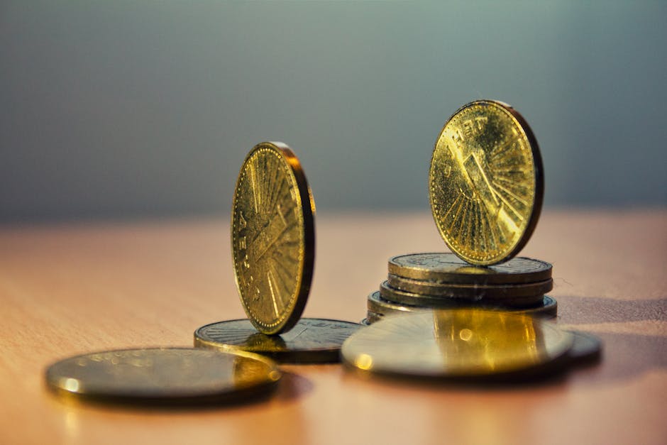 Close-up of North Macedonian denar coins on a bamboo table with artistic lighting.