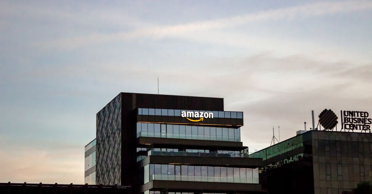 Contemporary architecture showcasing Amazon office at dusk in Iași, Romania.