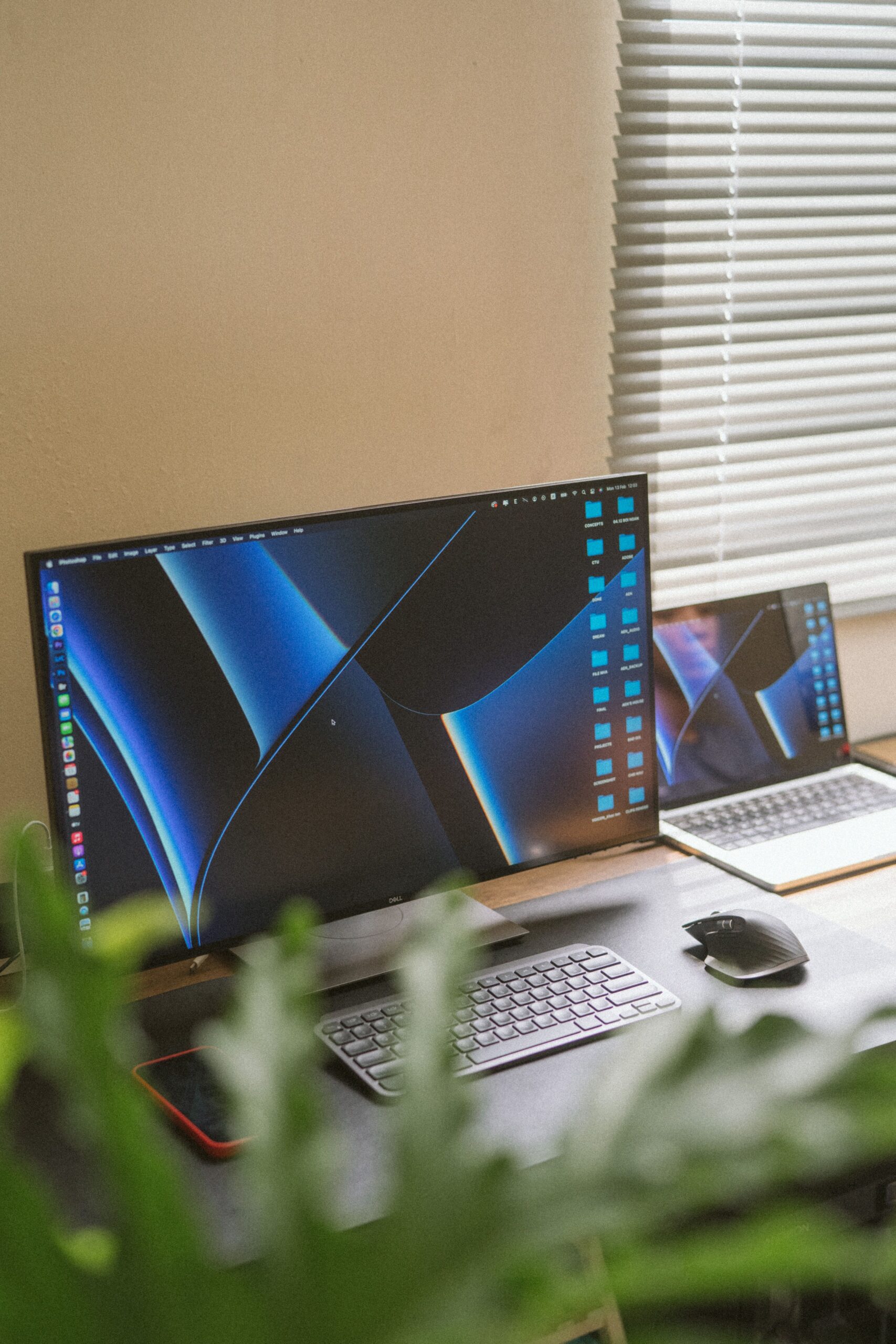 A contemporary office setup featuring a monitor and laptop in Cần Thơ, Vietnam.