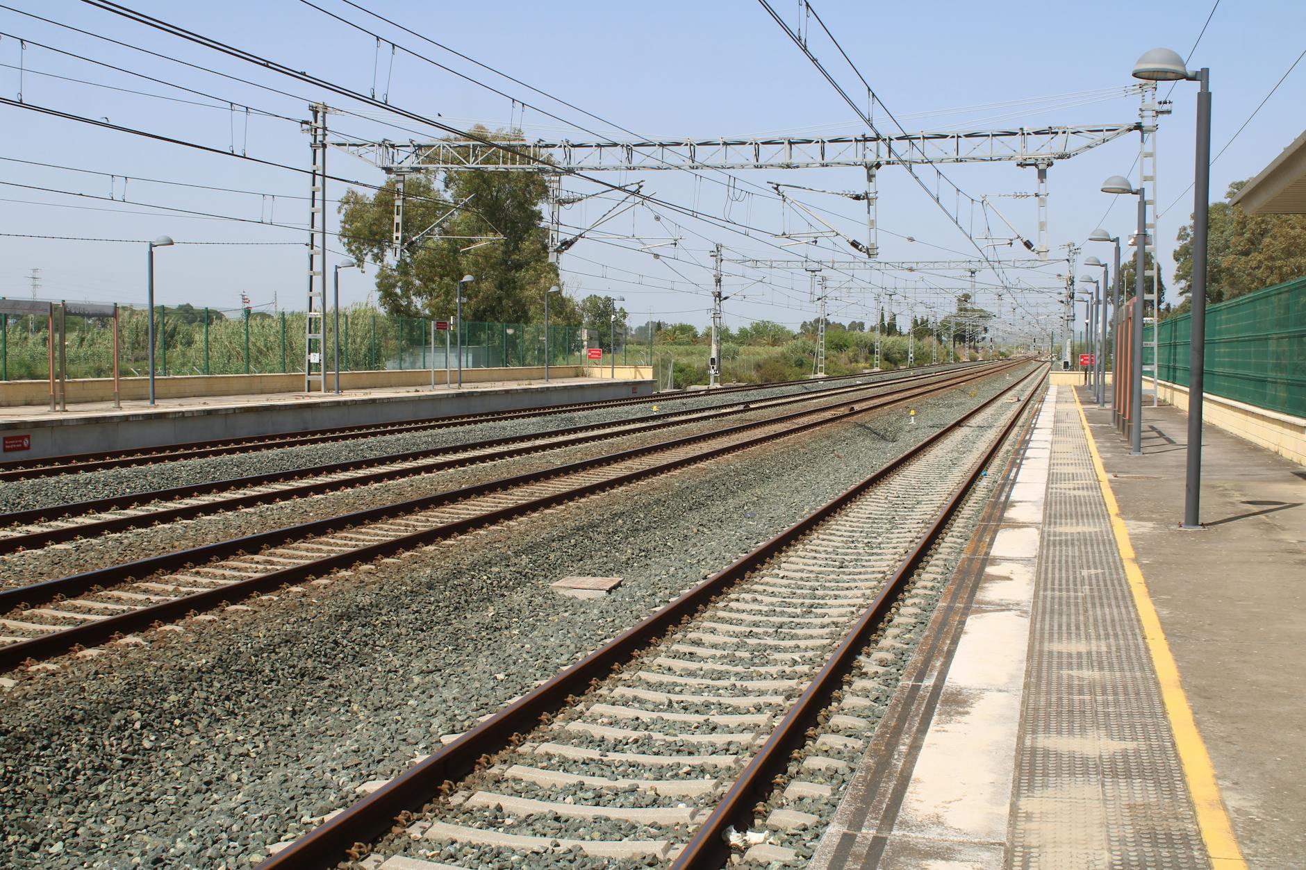 A clear view of empty railway tracks at Jerez de la Frontera station, Spain.