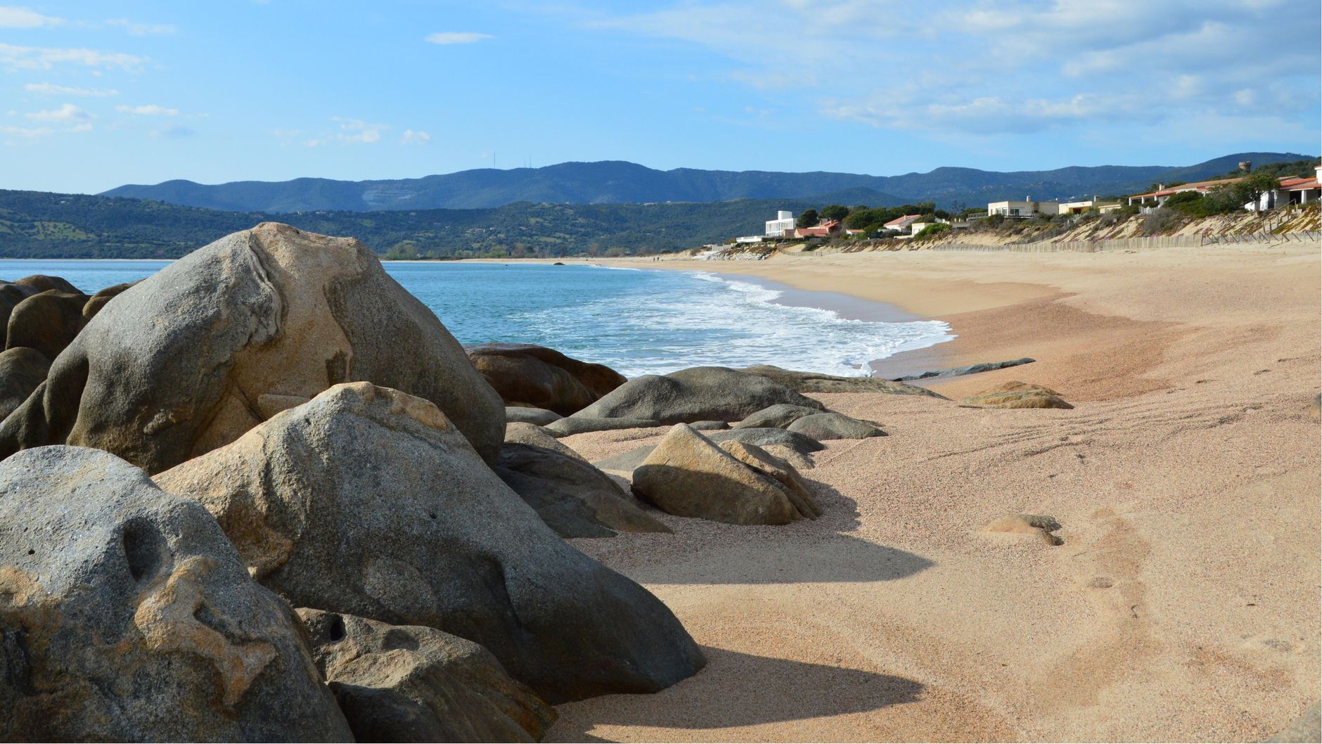 Beautiful beach with rocks and clear blue sea in Olmeto, Corsica, France.