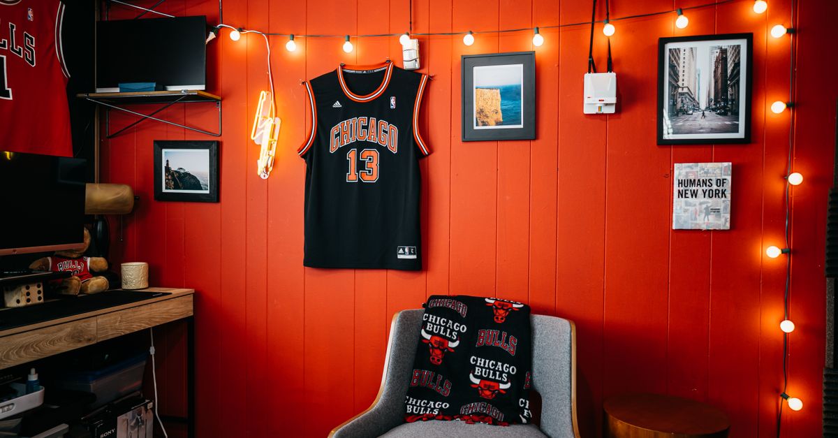 Cozy indoor space with Chicago Bulls memorabilia and vibrant red walls.