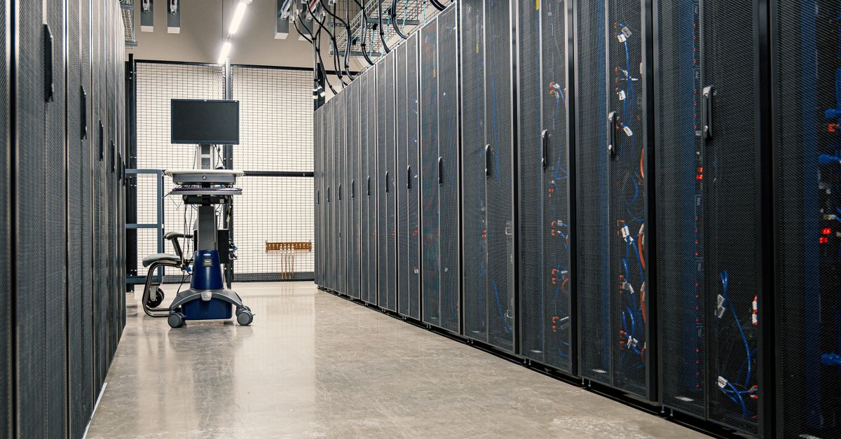 Steel framework cabinets housing servers networking devices and cables in contemporary equipped data center