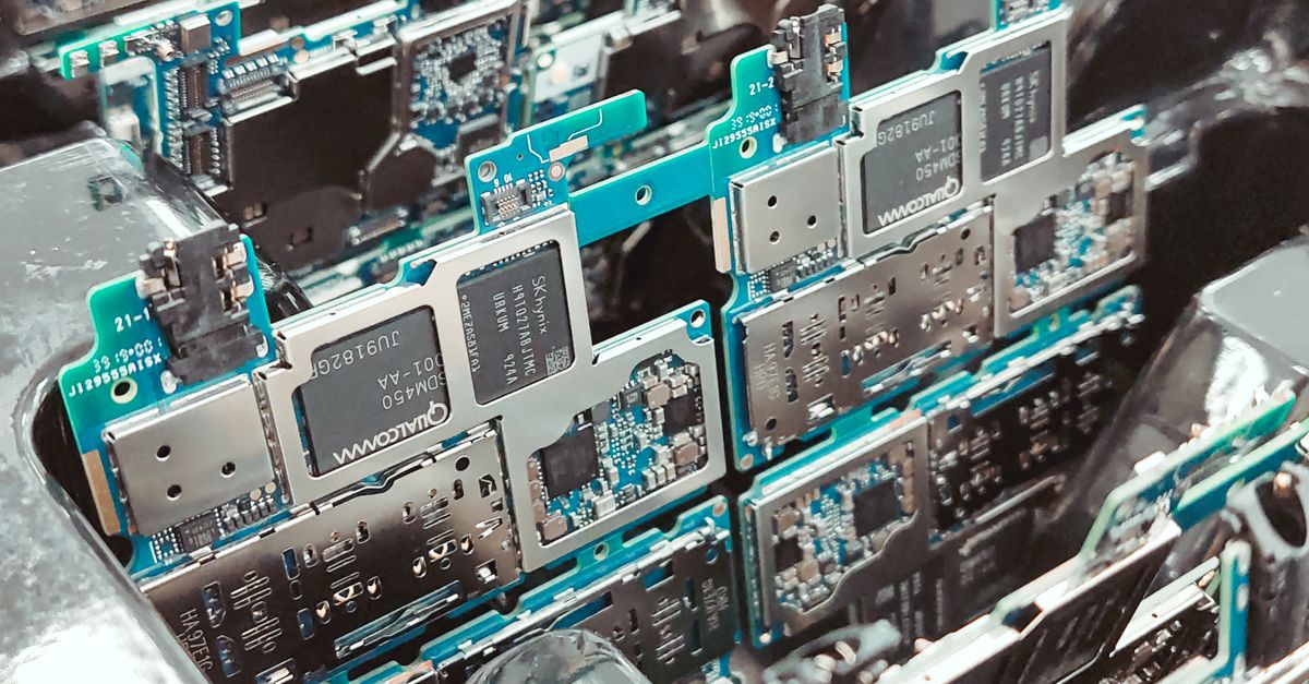 Close-up of intricate circuit boards in a Vietnamese factory, capturing modern electronics production.