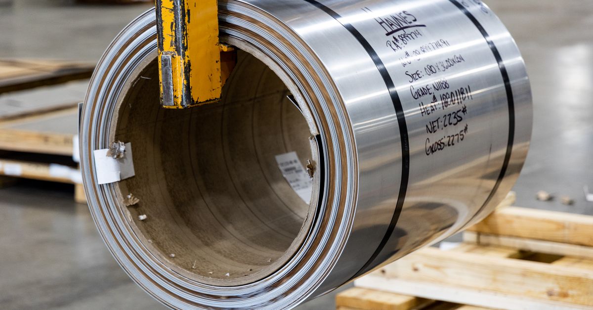 Steel coil in a modern warehouse, showcasing industrial materials ready for manufacturing.