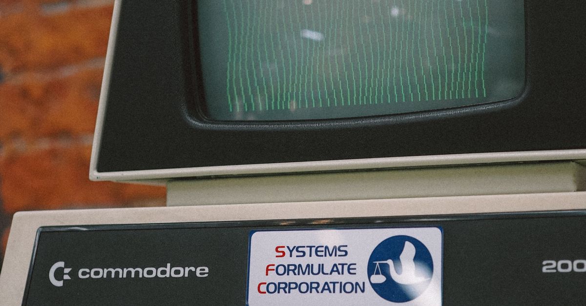 Close-up of a vintage Commodore computer with a CRT monitor and keyboard, showing retro technology.