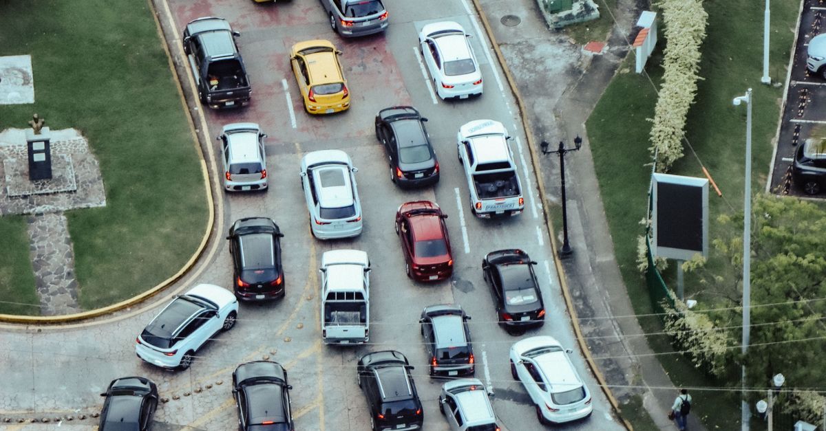 Overhead shot of cars in a traffic jam showcasing urban life and transportation dynamics.