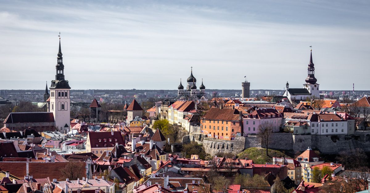 Scenic aerial view of Tallinn's old town with historic towers and rooftops.