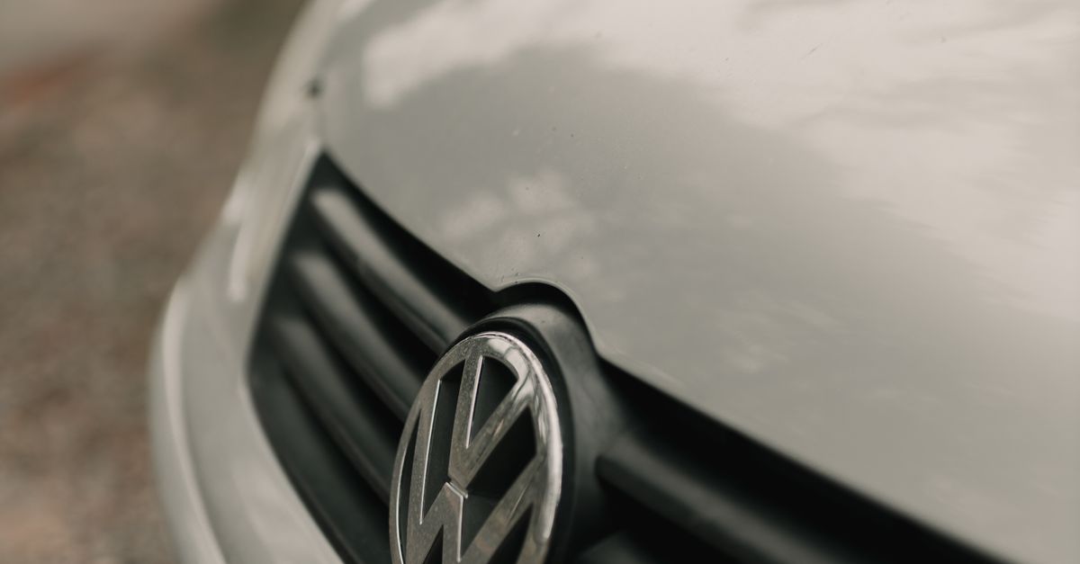 Detailed close-up view of a Volkswagen car badge emphasizing design and branding.