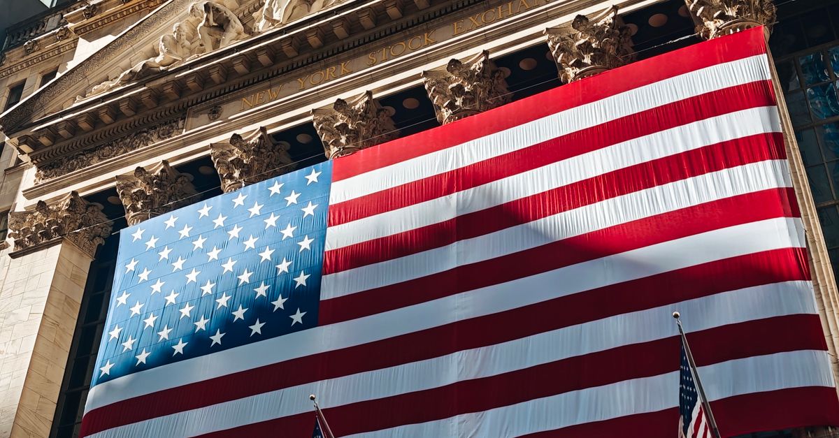 American flag adorning the iconic New York Stock Exchange building facade.