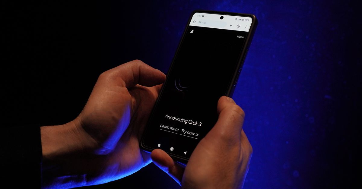 Close-up of hands holding a smartphone displaying 'Announcing Grok 3' on a dark background.