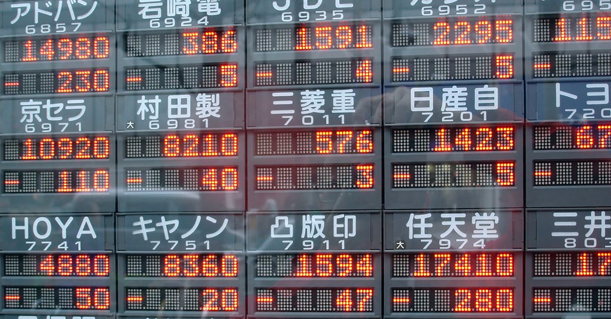 Digital display of stock market prices in Japan with kanji characters.