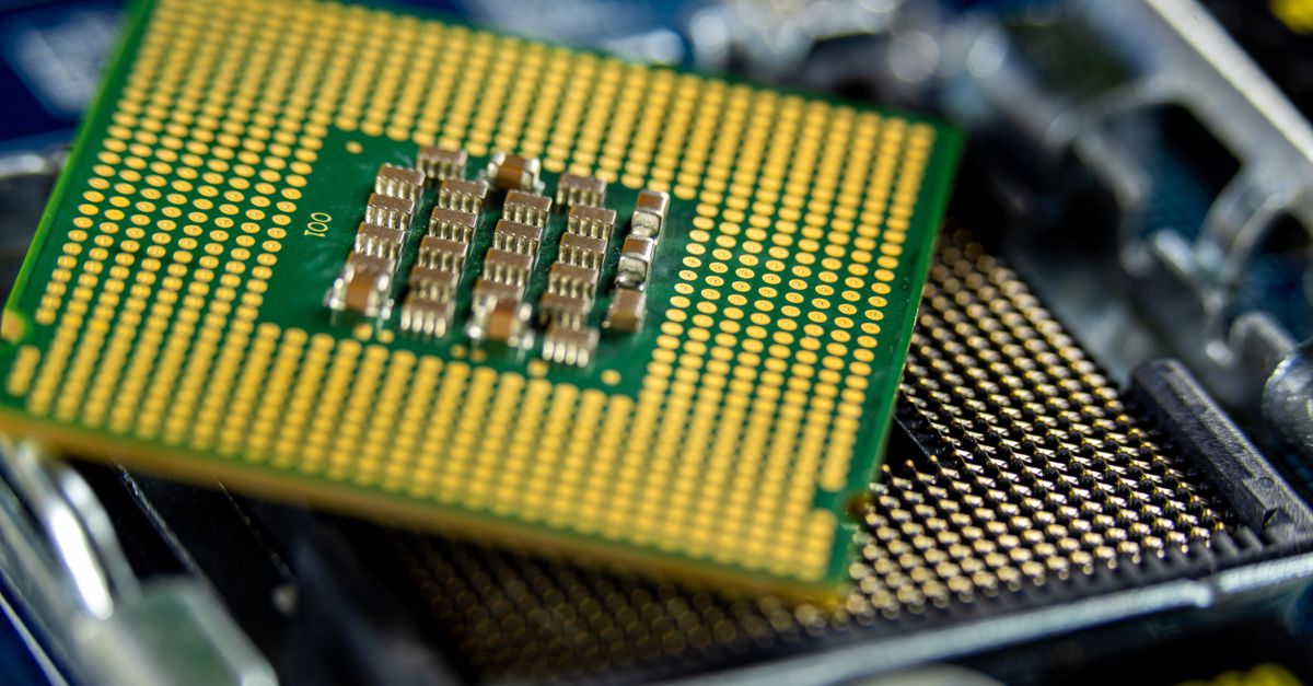 Detailed close-up of a microprocessor on a motherboard showcasing its intricate design.