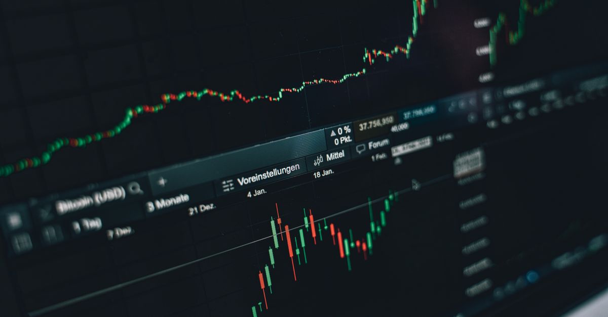 Close-up of a digital market analysis display showing Bitcoin and cryptocurrency price trends.