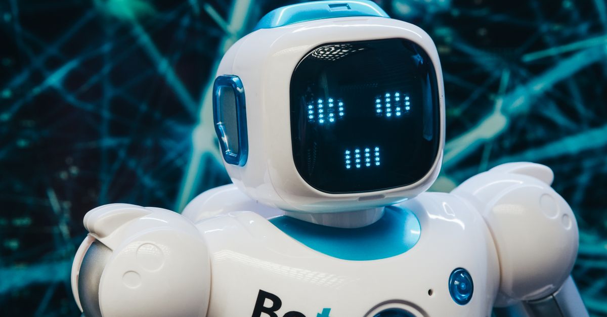 Close-up of a futuristic humanoid robot with a digital face display, representing modern technology.