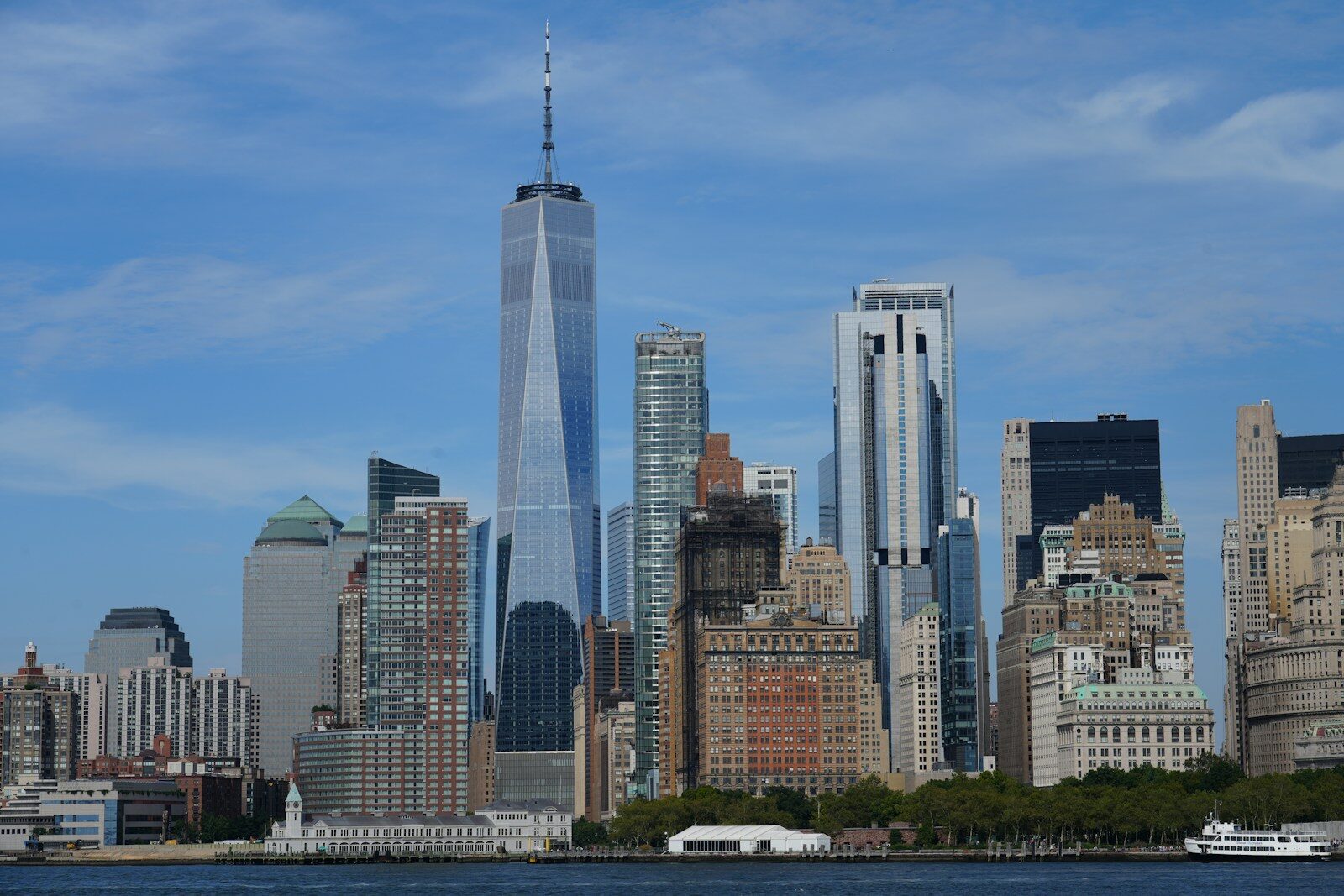 a large body of water with a city in the background